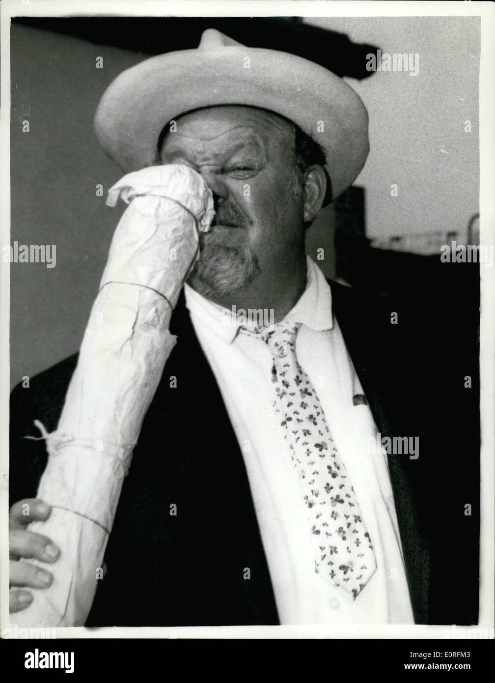 Jun. 06, 1959 - 6-6-59 Burl Ives arrives in London. Among the arrivals at London Airport yesterday was American singer-actor Burl Ives. He is to film here with Sir Alec Guinness in Our Man in Havana . Keystone Photo Shows: Burl Ives sniffs at a salami on arrival at London Airport yesterday. Stock Photo