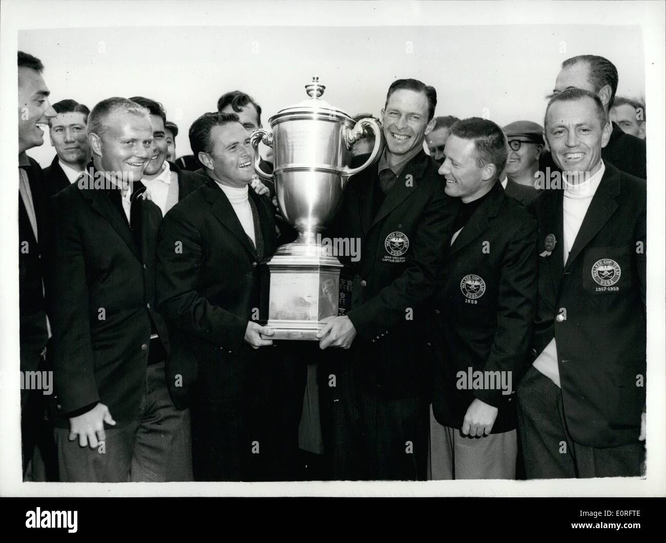 May 05, 1959 - America wins the walker cup. The United rtates won the walker cup by nine matches to three on the two days play at Muirfield. Photo shows The American team pictured with the walker cup after their victory at Muirfield .Holding the trophy are E.Harvie Ward (left), and Charles Coe (captain) Stock Photo