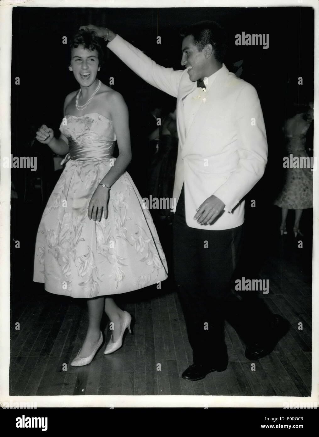 Jul. 05, 1959 - The Wimbledon men's and women's singles champion do the Cha-Cha at the Ball : Photo shows Wimbledon men's and women's singles champion - Alex Olmedo, of Peru, and Maria Bueno, of Brazil - rock to the rhythm of a Cha-Cha at the Wimbledon Ball, given by the Lawn Tennis Association at the Grosvenor House Hotel, London, last night. Stock Photo