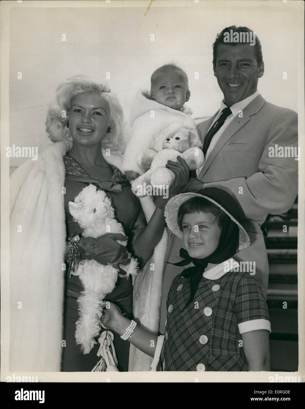 Jul. 07, 1959 - Jayne Mansfield Arrives: Jayne Mansfield, who is to start in a new British film, the Wigmoire Production ''Too Hot To Handle'', arrived at London Airport today with her husband, Mickey Hargitay and her nine-year old daughter, Jayne Marie, and baby son Niklas. Photo shows Jayne Mansfield with her husband and children on arrival at London Airport today. Stock Photo