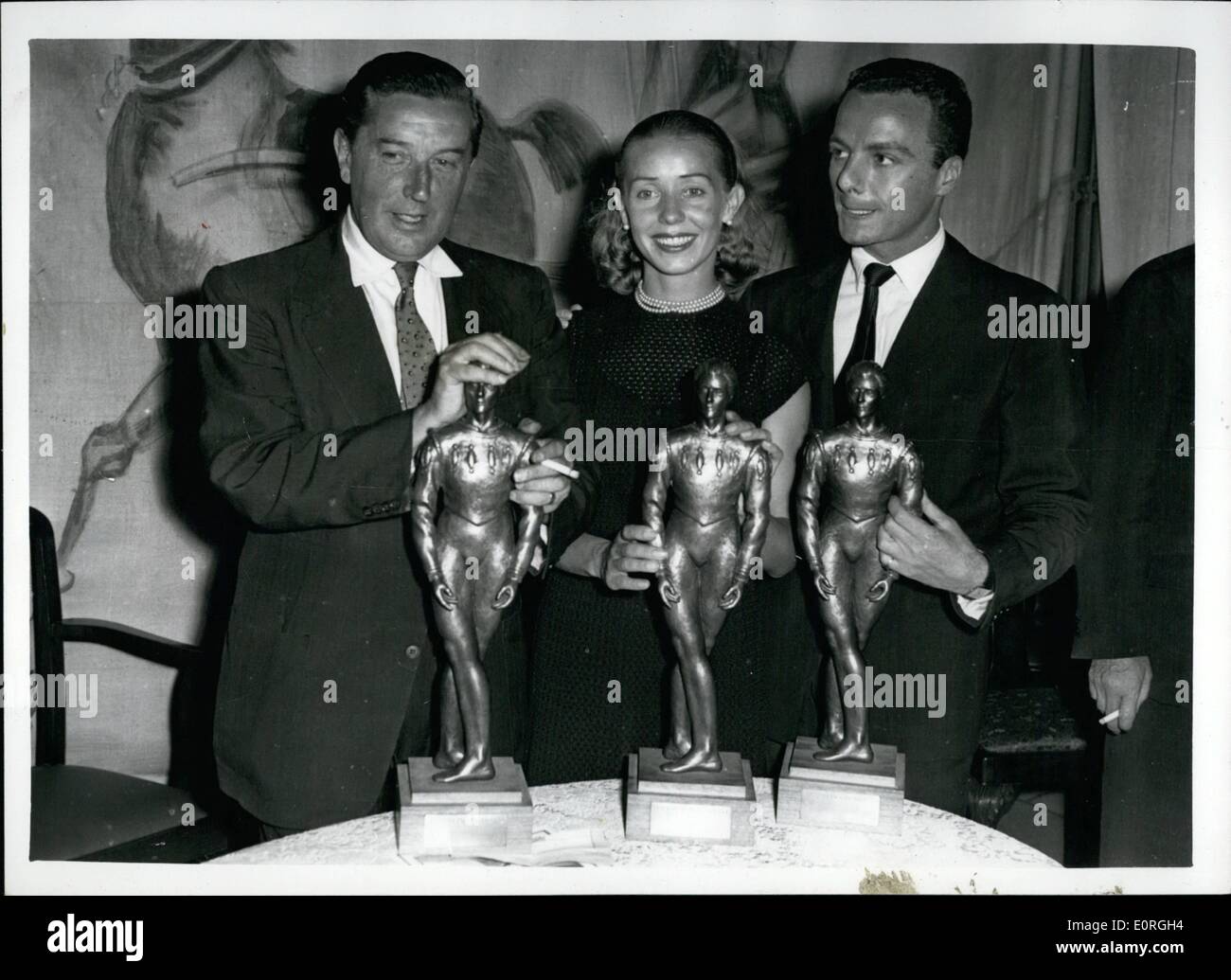 Aug. 08, 1959 - Presentation of the Anton Dolin Awards.: Her Serene Highness Princess Antionette of Monaco this afternoon presented the Anton Dolin Awards at the Circular Rooms, Army and Navy Stores. The awards are presented to the people who, in Dolin's judgement - ballet in the past year. Photo shows the three winners with their awards a this afternoon - L-R: - Frederick Ashton (winner of choreographer award; Nadia Nerina and John Gilpin the da award winners. Stock Photo