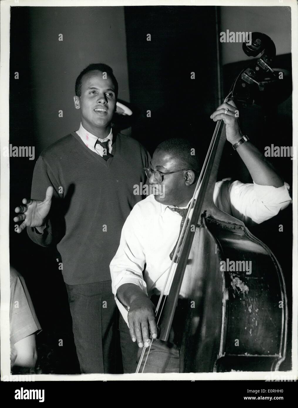 Sep. 09, 1959 - Harry Belafonte rehearses for his B.B.C. television program next Sunday: Harry Belafonte, the distinguished American artist, makes his third appearance on B.B.C. television in a 45-minute program of Music and song on Sunday Sept. 20th . Today he was busy rehearsing for the show. Photo shows Harry Belafonte is accompanied by Norman Keenan on his bass during the rehearsals at the B.B.C. Riverside Studios, Hammersmith, today. Stock Photo