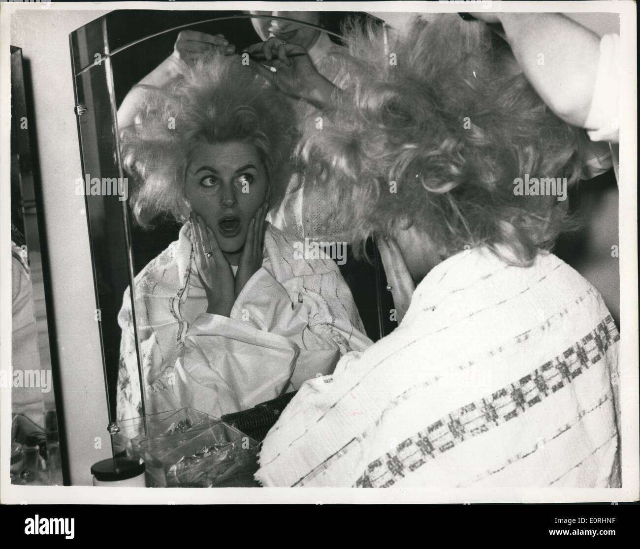 Nov. 11, 1959 - Hair-Do For ''Miss Wold'' Competitions Miss Austria In The Mirror: Monday of he ''Miss World'' competitors received a final hair-do this afternoon - at the Old Bond Street Salon of Mr. Leonard Taylor. Photo shows Miss Austria (Helga Knodel) looks at herself in the mirror - as he hair was fixed this afternoon. Stock Photo