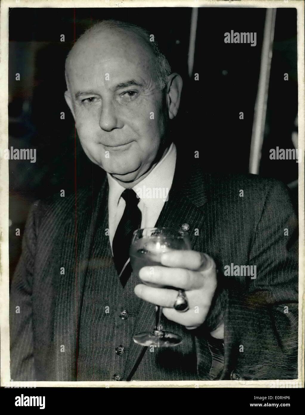 Nov. 11, 1959 - Vice admiral Marshall here to promote Bourbon whisky: Vice Admiral William J. Marshall who is President of the Bourbon Institute in America, is voer here to promote bourbon whisky already America's national drink to rank alongside Scotch as one of the world's two great whiskies. He gave a Press Conferecen this evening at Claridge's Hotel. After a distinguished career in World War II, he recently retired as Director of the U.S. Navy's Division of Material. Photo shows Vice Admiral William J. Marshall holds a glass of bourbon at the Press Conference today. Stock Photo