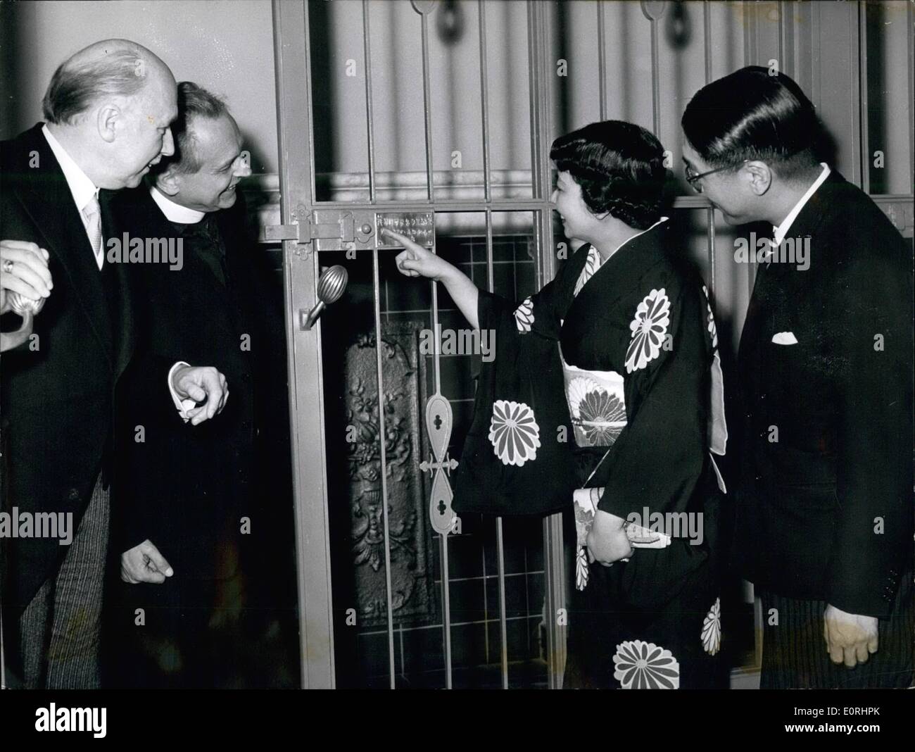 Nov. 11, 1959 - Let us open the door to peace and freedom..............said the Minister of Education from Nordrhein Westfalen (Germany) Prof.Luchtenberg, when presenting the inside doors for the peace Church at Hiroshima (Japan) to the members of Japanese legislation Akira Sono. the leafs are produced by Karl Konig (Bonn) and show as motive the lotos. Photo Shows From L. to R. Minister of education of Nord-Rhein Westfalen Luchtenberg (Prof. Luchtenberg) Pater Luttenbeck (Lutterneck) Mrs.Sono (Mr. Sono), members of the Japanese legation Akira Sono (Akirta Sono) Stock Photo