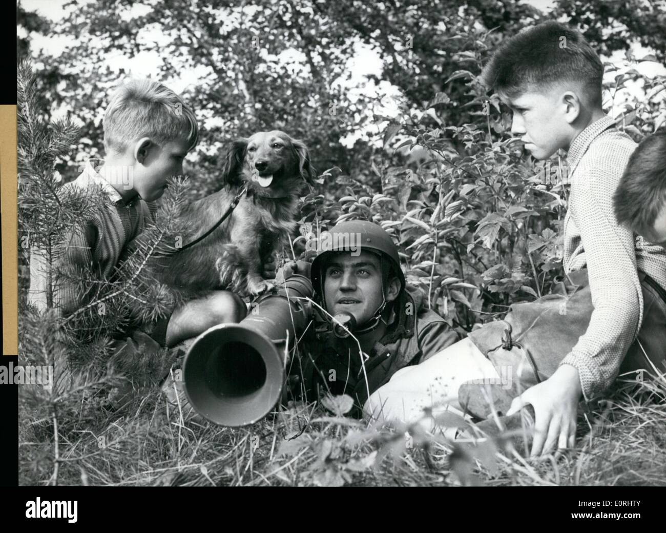 Sep. 09, 1959 - Three Boys and a Dachshund: discovered at the West German Army military exercise a parachutist who hid himself with an anti-tank rocket a ''Bazooka'' (BAZOOKA), and there was nor more disguising. The so far biggest military-exercise of the West German Army started on the 31st August 1959 on the training area Heuberg (HEUBERG) and has the name Army 2 500 of the Air-Force and 1 300 soldiers of the 35th american Artillery Regiment. Stock Photo