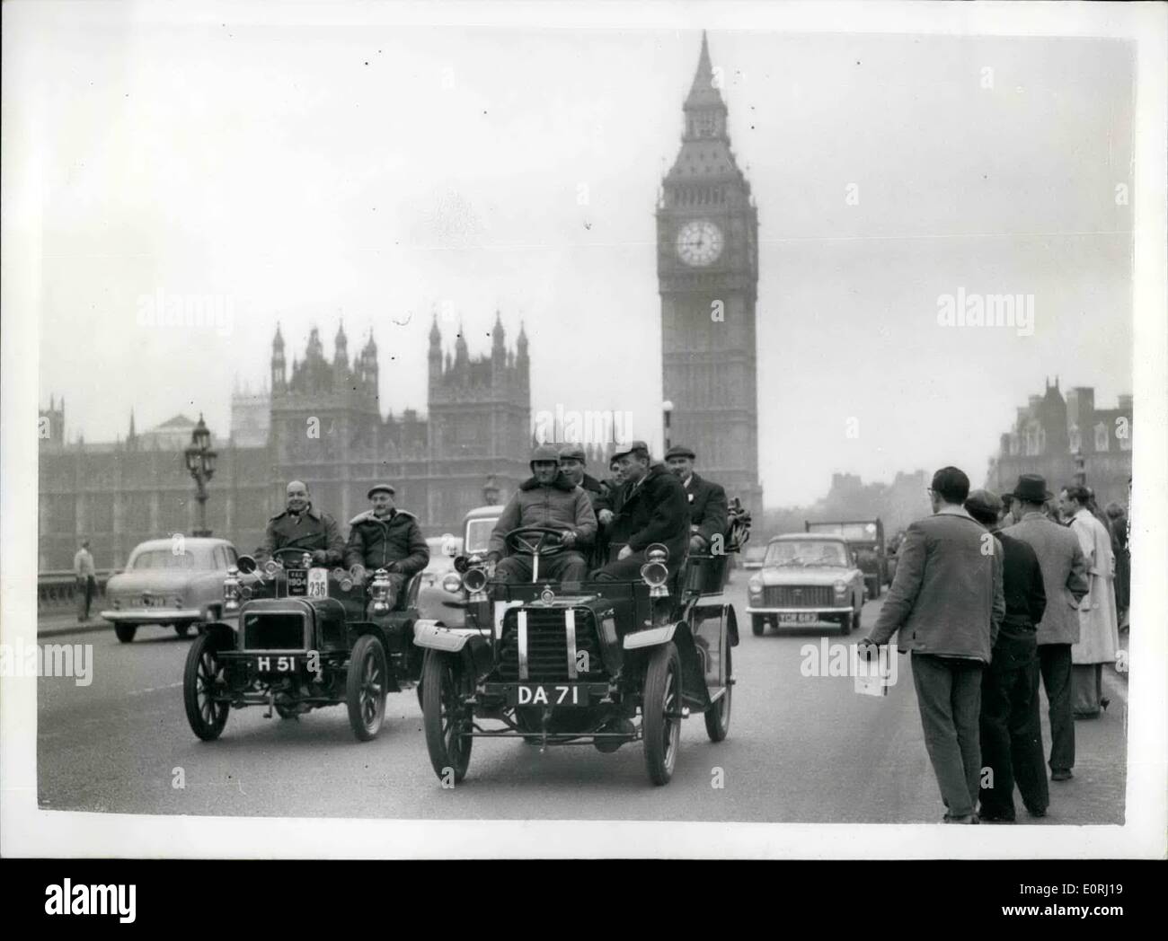 Nov. 11, 1959 - London To Brighton Veteran Car Run: Competitor with their ancient vehicles were to be seen at start from Hyde Park this morning of the annual R.A.C. London to Brighton Veteran Car Rub.. Photo Shows: Jack Braham the world famous racing car champion - in his 1904 Sunbeam slightly ahead of the 1904 Swift of the Montague Motor Museum and driven by Mr. P. Harper - as they cross Westminster Bridge this morning. Stock Photo