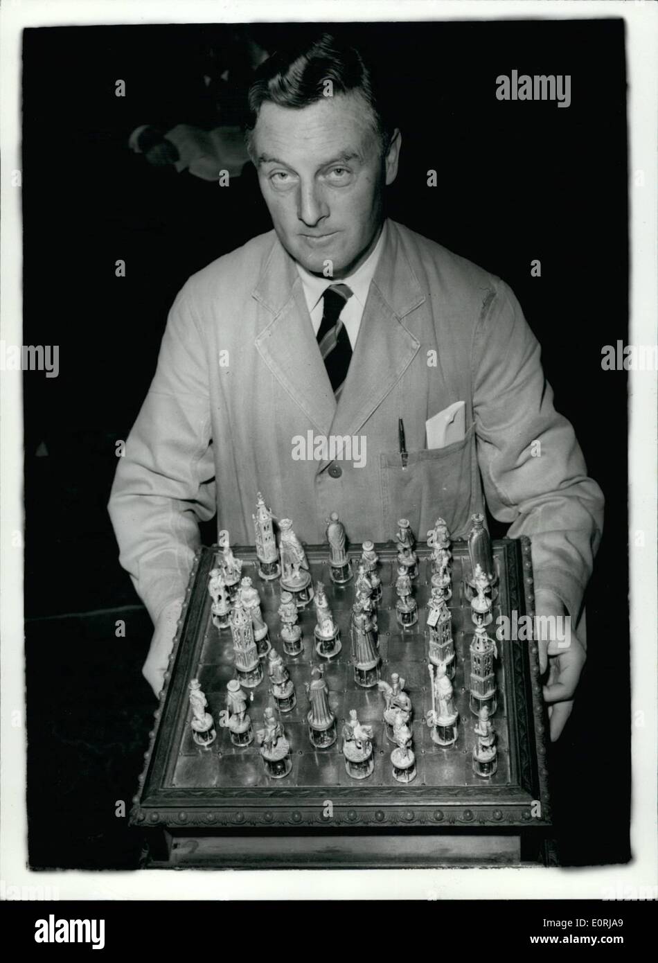Nov. 11, 1959 - Jewelled chess set once owned by Czars of Russia for sale at Christies.: Mr. Frank Parsons of Christies seen with a gold and jewelled Russian Presentation Chess Set once the property of the Court of the Czars of Russia which is to be sold today and which is expected to fetch something in the region of 3,000 Stock Photo