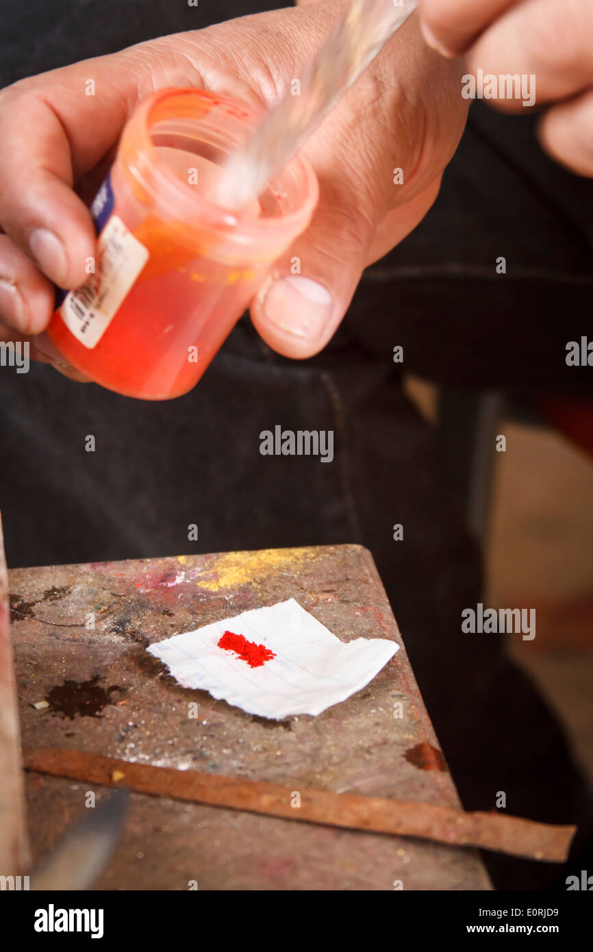 Pasto varnish manufacturing process. Coloring the resin. Stock Photo