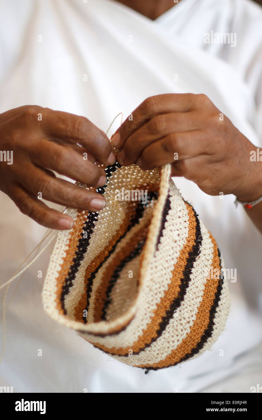 Woman weaving rucksack Arhuaca; Magdalena, Colombia. Stock Photo