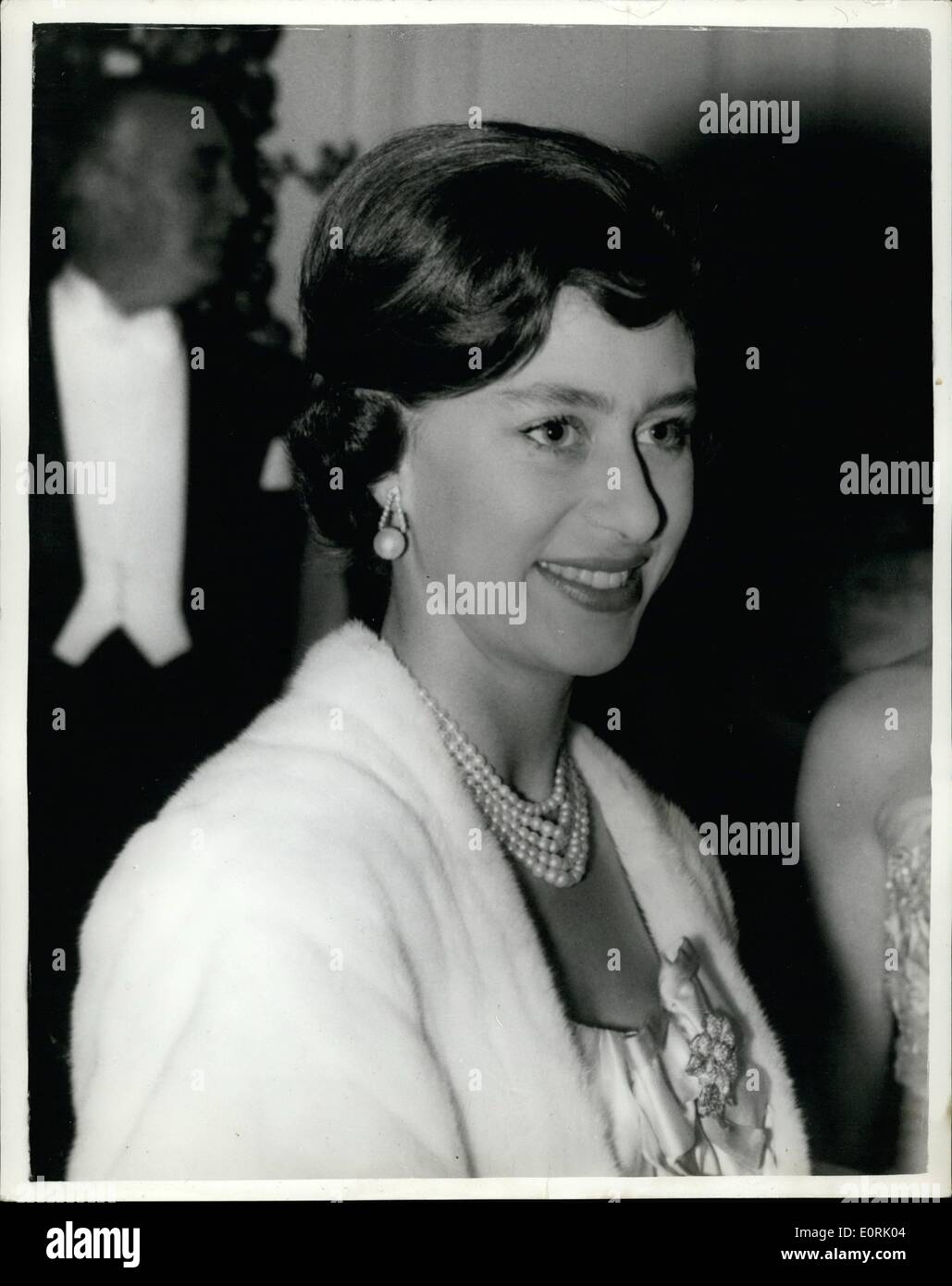 Oct. 10, 1959 - Princess's hair style for the ball. : Photo shows H.R.H. Princess Margaret wearing new hair-style and pearl earrings, pictured as she met other guests at the Dockland Settlements Ball at the Savoy Hotel, London, last night. Stock Photo