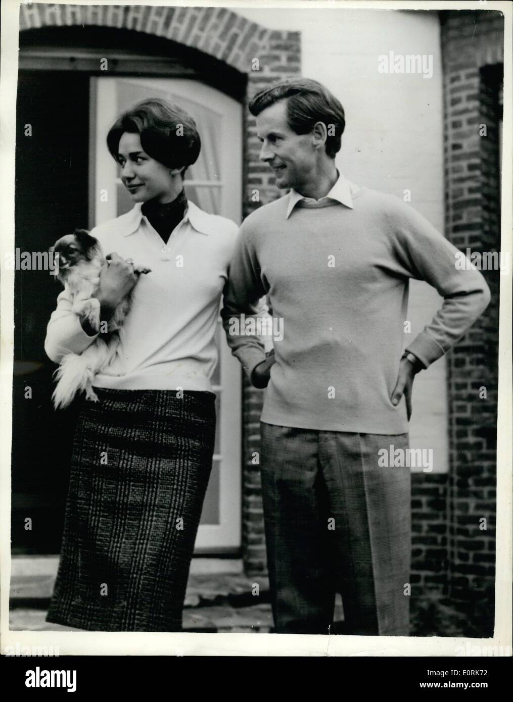 Oct. 10, 1959 - 12-10-59 Group Captain Peter Townsend to marry his secretary. The engagement has been officially announced of Group Captain Peter Townsend, former suitor of Princess Margaret and 20 year old Marie Luce Jamagne, daughter of a wealthy Belgian cigarette manufacturer. Keystone Photo Shows: Peter Townsend and Marie Luce-Jamagne at the home of her parents near Antwerp yesterday. Stock Photo