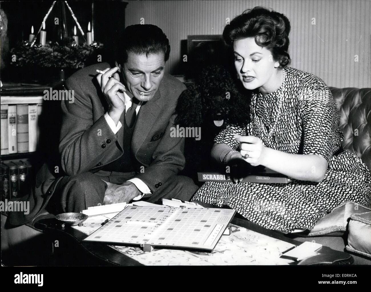 Dec. 12, 1959 - Best-seller from USA on the Christmas-market The new game ''Scrabble'' which is already a best-seller in the USA is becoming a new hobby for spare time in Germany for all the family. The game consists of a board with 225 fields and of a hundred game-stones. Every stone has one letter of the alphabet printed on one side. You have to put the stones on the table so that you can see the letters clearly. Then each player takes seven stones like a crossword-puzzle you lay a trellis of words. Each letter has now a certain amount of points Stock Photo