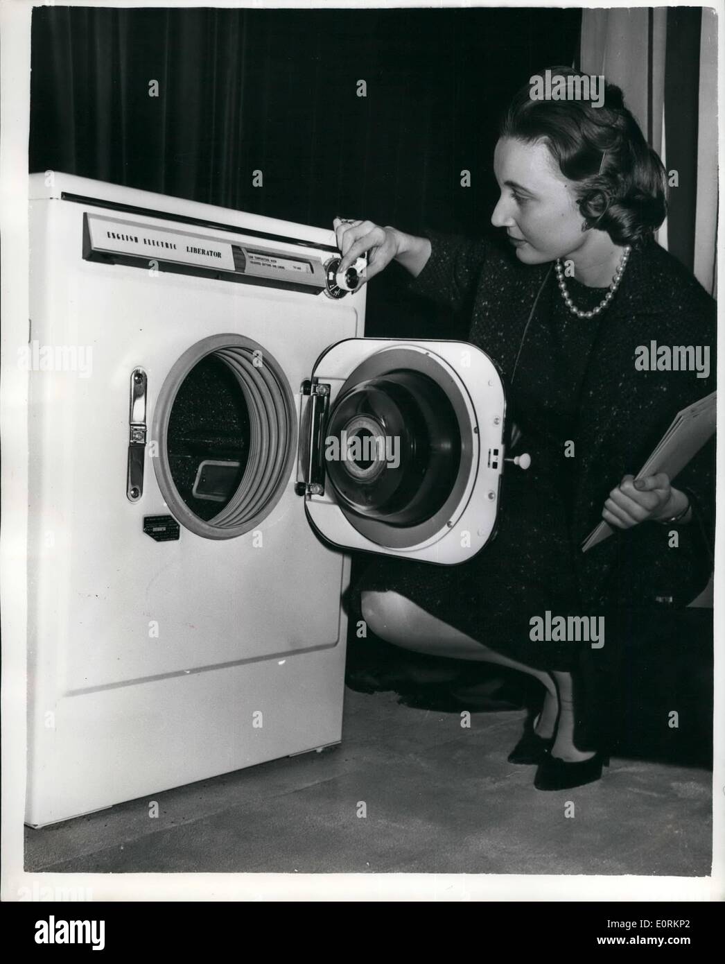 Jan. 01, 1960 - Introducing The New English Electric ''Liberator'' Washing machine The new English Electric ''Liberator'' Washing Machine - which automatically - by the setting of a unique dial - heats - washes - rinses - spin dries etc. The dial can be set for any type of material to be washed. It opens with between 6 and 7 lbs. at a time - was shown at the Savoy Hotel. Price 105 Gns.. Keystone Photo Shows:- Miss Jill Pound-Corner of Kensington, examines the new English Electric ''Liberator'' at the Savoy Hotel. Stock Photo