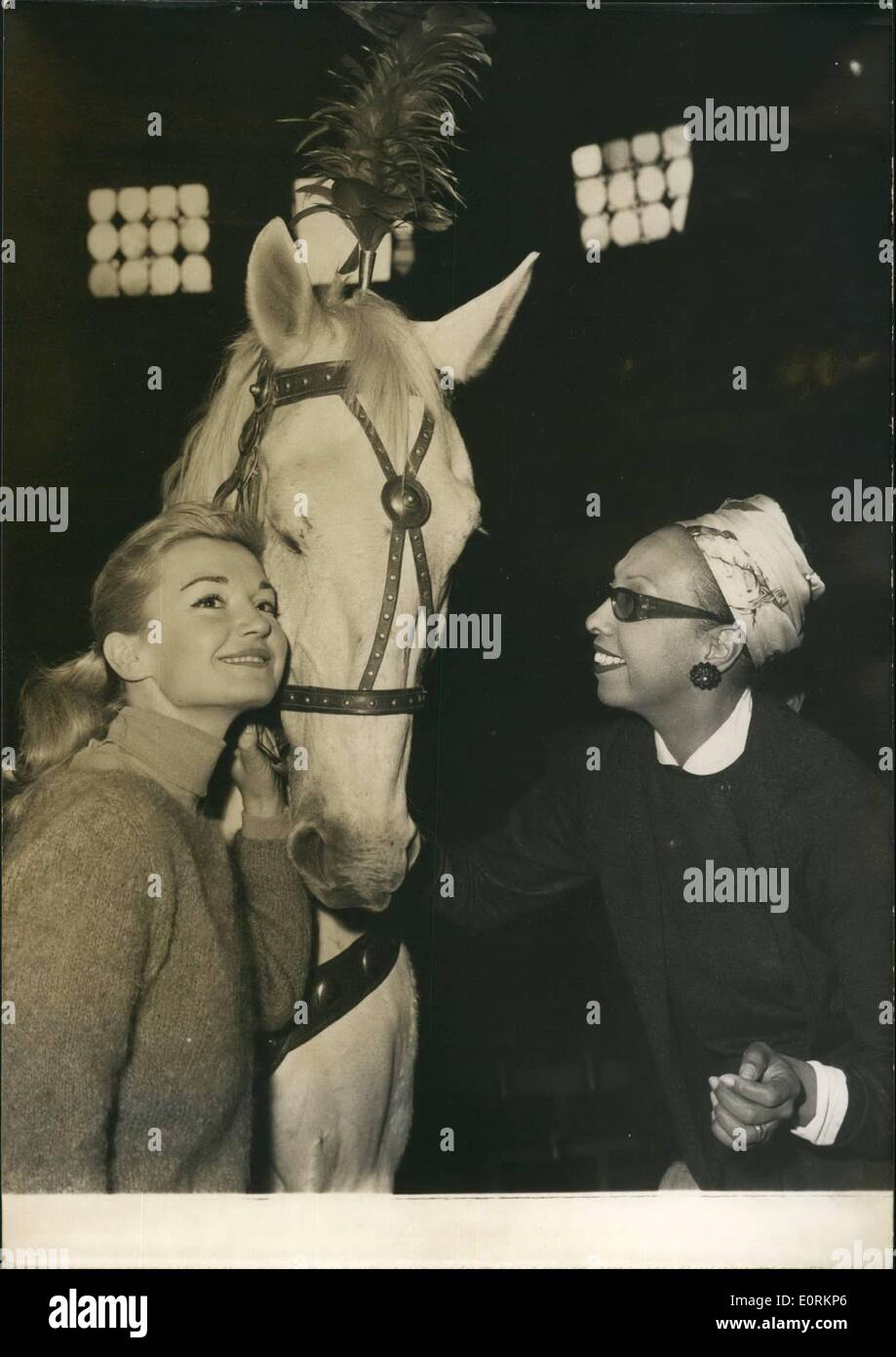 Jan. 01, 1960 - Josephine to introduce Joseph.: Screen , stage and music hall actors and actresses are now rehearsing the various acts they will present at the annual union of artists' Charity shows to be held at the cirque D'Hiver Paris. Photo shows Josephine Baker with the circus horse ''Joseph'' she will introduce at the Charity show. on the left the young actress Brigitte Auber who is also participating in the show. Stock Photo