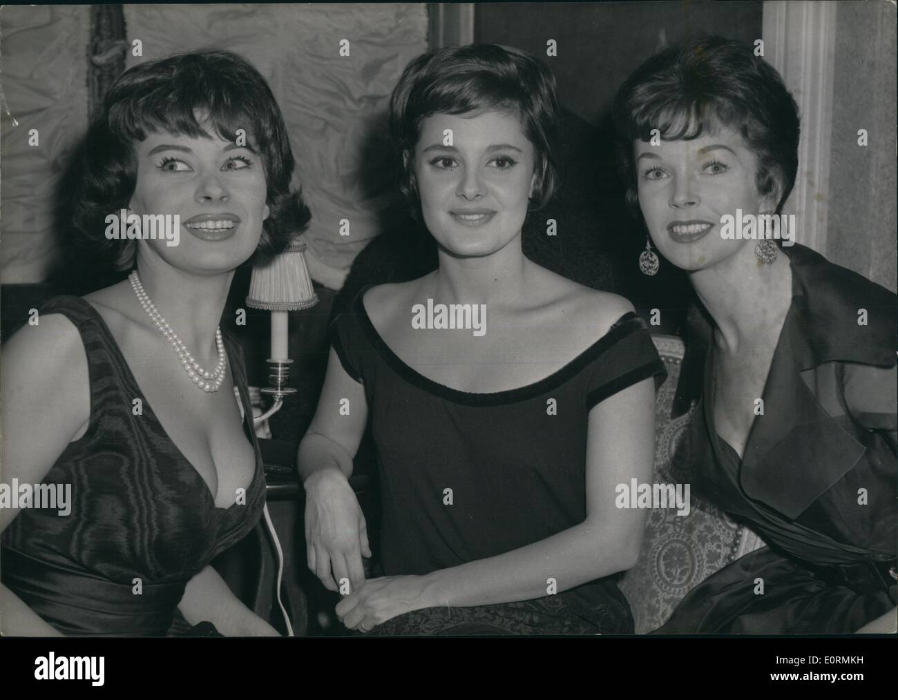 Jan 1, 1960 - The three pretty stars of the film: ''L'ile Du bout Du Monde'': A cocktail party was given at Maxim's yesterday evening for the release of Edmond T. Greville's new film base on Henri Crouzat Novel, in which are co-starring: Rossana Podesta, Dawn Addams Magali Noel and christian Marquand. Photo shows left to right: French star, Magali Noel - Italian star Rosanna Podesta and Dawn Addams. Stock Photo