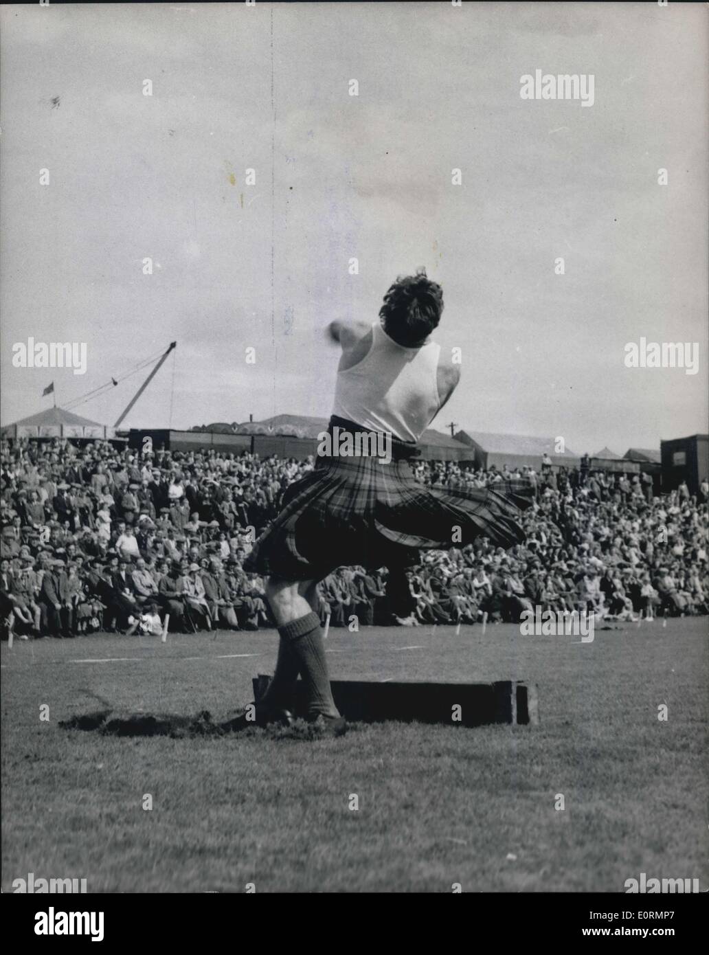 Jan. 01, 1960 - Crieff Highland gathering at Market Park, Crieff: L.K. Stewart of Fort William whirla round and round he makes a record throw for the 22lb Hammer of a distance of 110ft. 6 1/2 inches. He wears the Hunting Stewart tartan. (exact date unknown) Stock Photo