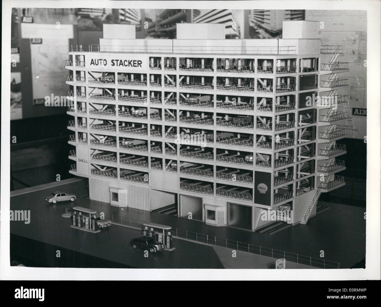 Mar. 03, 1960 - Car Parking Exhibition In London: Photo shows. View of a model of the eight-storey garage to be built at the site of the old Empire Theatre at Woolwich, london, pictured at today's Press preview of the Car Parking Exhibition at the Institute of Civil Engineers. The garage will be the first of two on the site, and will be fully automatic. It will provide 256 car spaces, each costing 400, exclusive of land. (the ground floor will not be used for parking). The cars will be attendant parked, by mechanical lift, at a rate of intake and discharge of one per 50 seconds Stock Photo