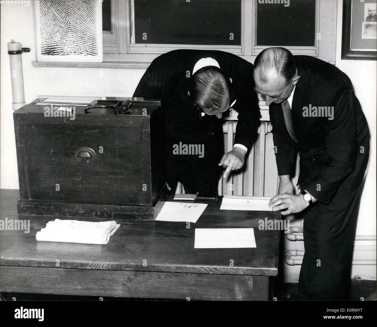 Mar. 03, 1960 - Prince Philip has his Fingerprints taken at New Scotland Yard: Prince Philip spent six hours at New Scotland Yard yesterday studying police methods, looking at horror weapons in the Black Museum, visiting the Rogue's Gallery, the Forensic Laboratory and the Fingerprint department, where he agreed to have his fingerprint taken. Photo shows Prince Philip has his fingerprint taken by Chief-Superintendent J.W.GODSELL during his visit to New Scotland Yard yesterday. Stock Photo