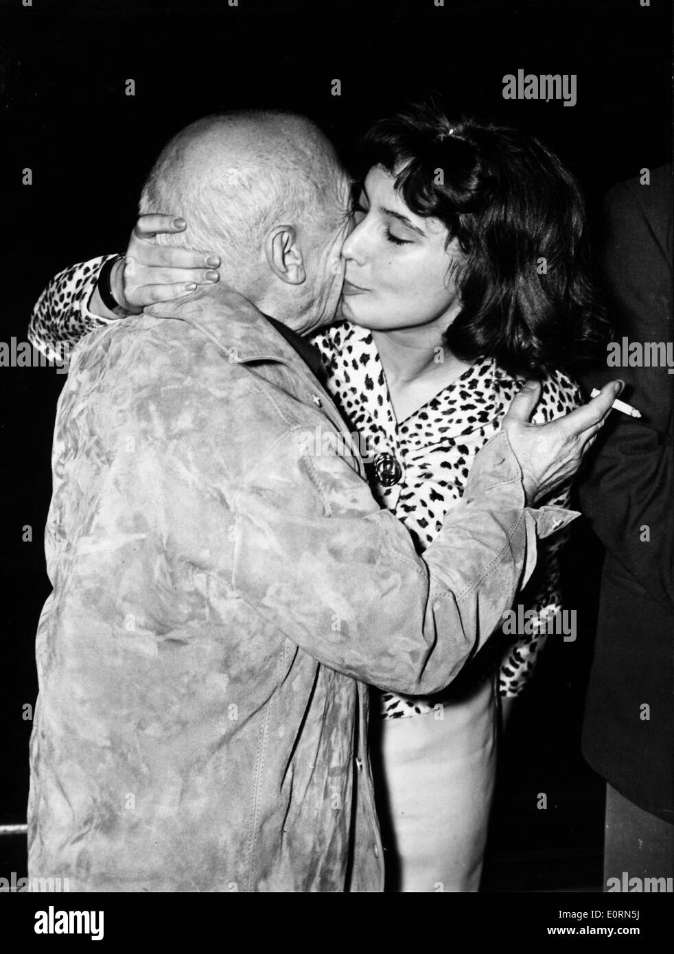Artist Pablo Picasso kissing Tatiana Samoilova at the Cannes Film Festival Stock Photo