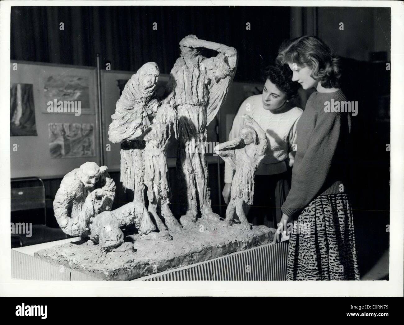 Jan. 20, 1960 - Lambeth Council;s First Schools Art Exhibition ''Te Refugees'': The Lambeth Council's first Schools Art Exhibition opened this morning at the Assembly Hall, Lambeth Town Hall. It includes paintings - drawings potato outs pottery - woodcarving etc. Photo shows ''The Refugees'' - the work of Veronica Ward an Maureen Carthcart - both and both of the Vauxhall Maner Secondary Modern School - at the exhibition today. Stock Photo