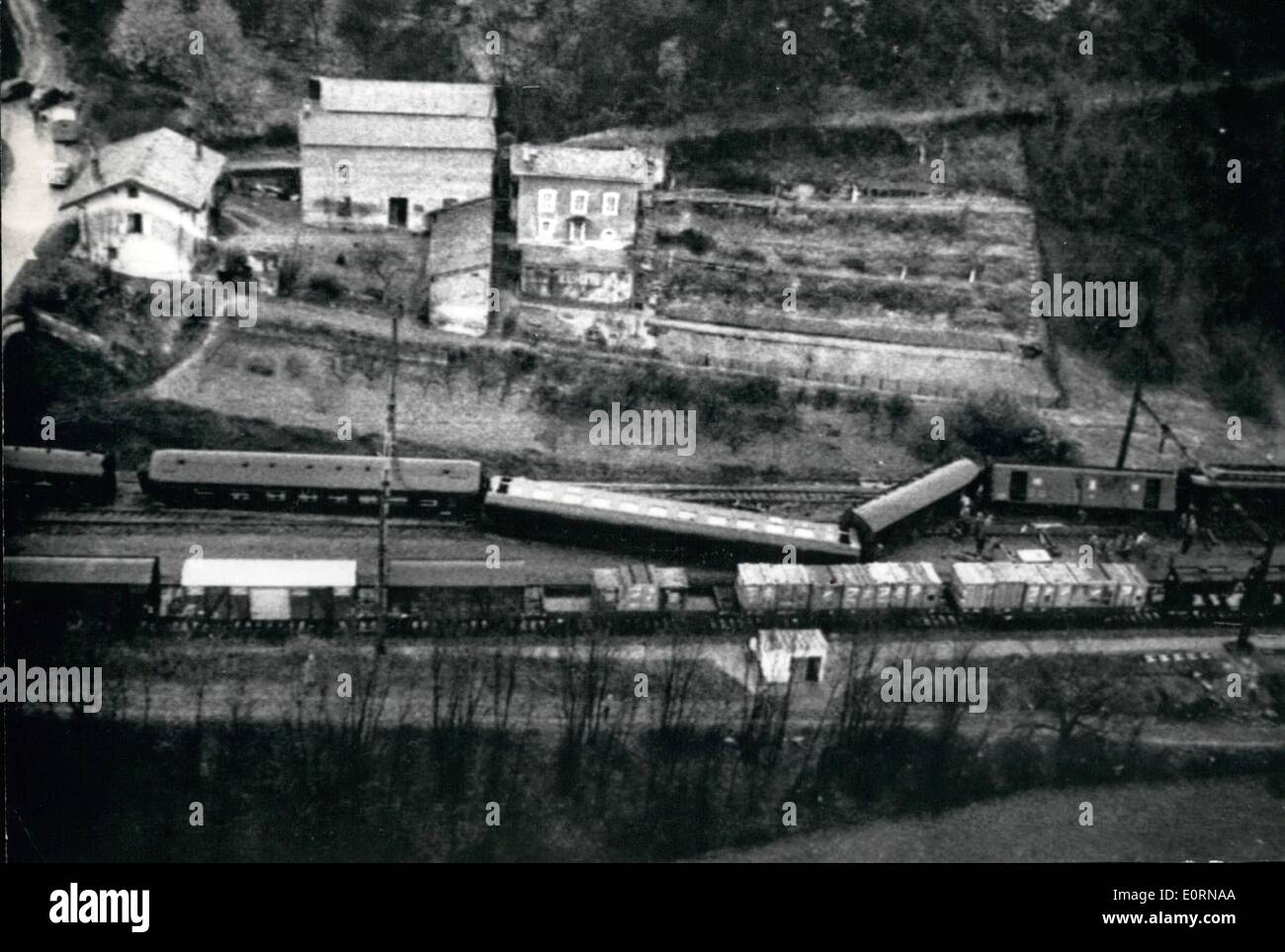 Mar. 03, 1960 - Investigators Into Paris-Cannes Ex Train Crash Think Derailment Result Of Sabotage: Police inspectors and officials investigating into the Paris-Cannes Train Crash hold the opinion that the derailment might have resulted from an act of Sabotage; Photo Shows: An aerial view of the overturned cars near Lyons. Stock Photo