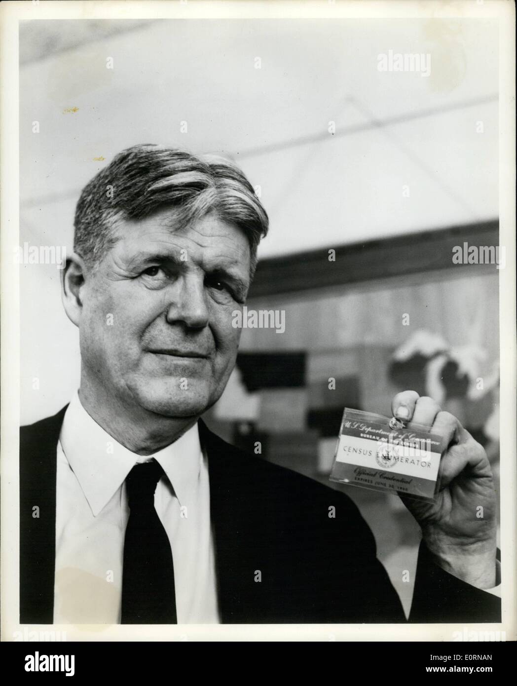 Mar. 03, 1960 - Picture Feature - The 1960 Federal Census Dr. Robert W. Burgess, Director of the Bureau of The Census, holds the official credential which the 160,000 men and women will wear on their outer garments when conducting their assignments as census enumerators. Stock Photo