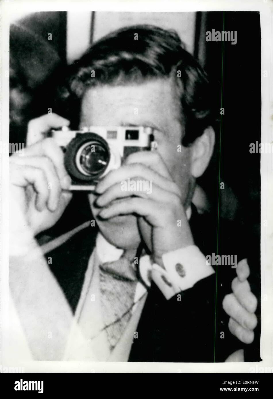 Feb. 02, 1960 - Princess Margaret to Marry Photographer, he photographs a wedding; The engagement was announced last night between H.R.H. Princess Margaret and photographer Tony Armstrong Jones who made a name for himself as a society photographer with his portraits of members of the Royal family. Photo Shows Tony Armstrong Jones in action with his camera. Picture taken when he photographed the wedding of actress Anna Massey to actor Jeremy Brett at Highgate Village in May 1958. Stock Photo