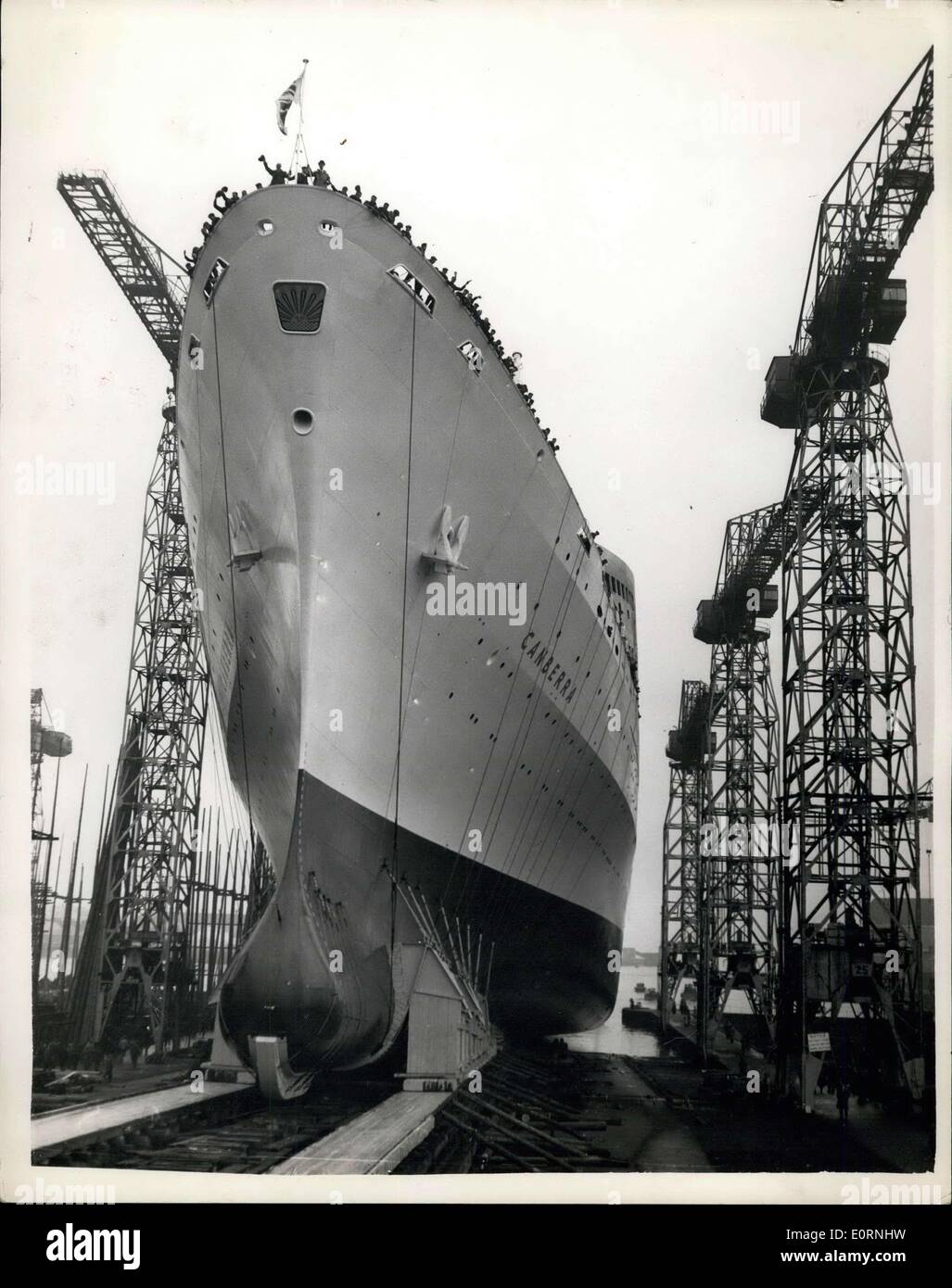 Mar. 16, 1960 - Dame Pattie Menzies launches Britain's Newest liner. The ''Canberra'': Dame Pattie Menzies wife of the Australian Prime Minister this afternoon launched the 45,000 ton Canberra - Britain's newest liner for the London - Sydney route - P. and C. line. With her speed of 27 knots she will out the time for the journey from 31 to 25 days. She will carry 2,235 passengers -cist ?15,000,000 to build - has 15 decks - and is 830 ft. long. Built in Belfast. Photo shows view of the liner as she slides down the slipway - at the Harland and Wolff Shipyard, Belfast this afternoon. Stock Photo