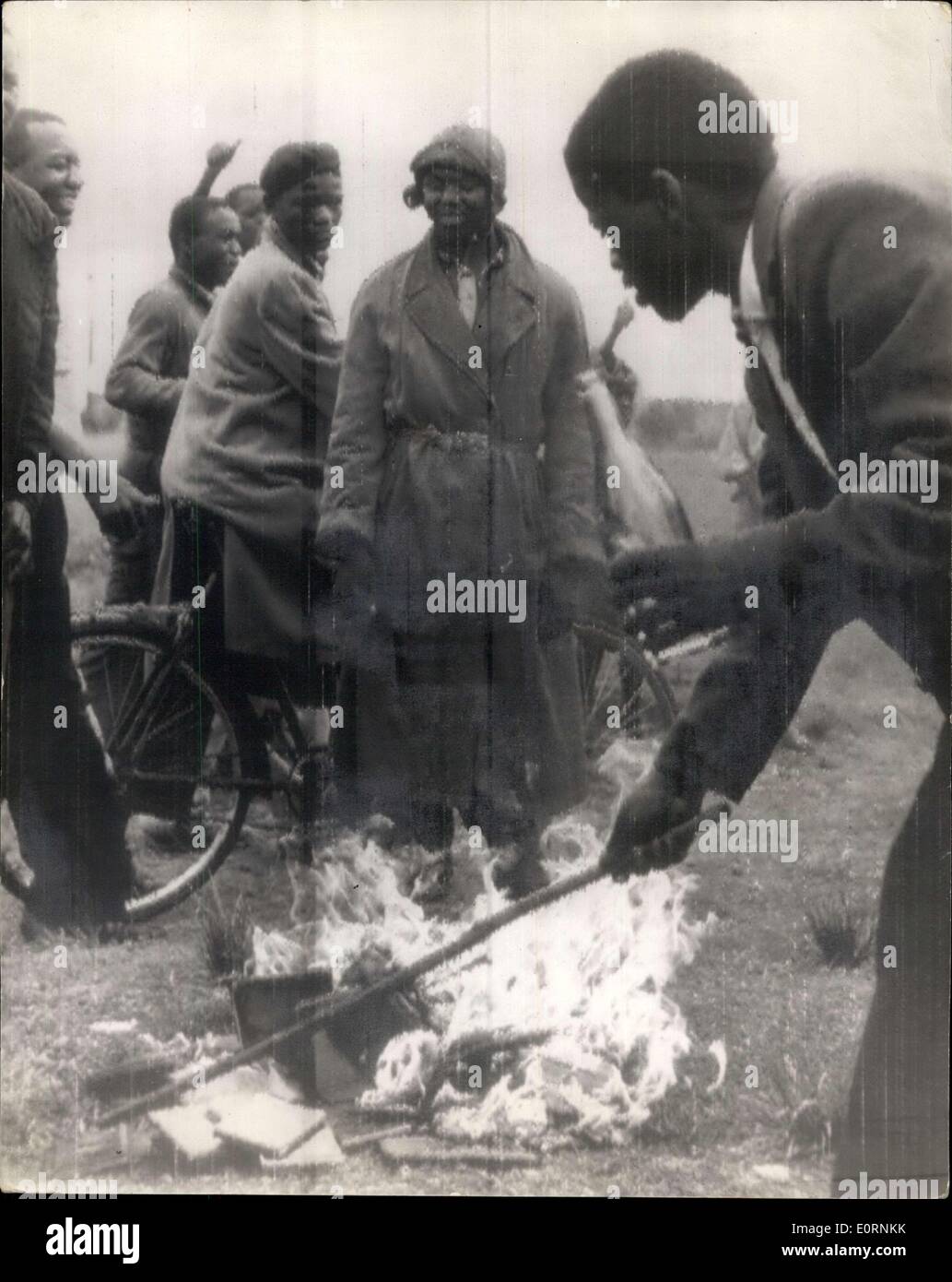 Mar. 28, 1960 - Natives Burn Their Was Pass Books: Africans today made a bonfire of their pass books as they marked a day of mourning for the 71 victims of last Monday's police shootings. The burning from the recent announcement of the suspension of the 'Pass' Law. Photo Shows The scene as natives burned their pass-books Orlando today - after the recent auspension of the 'Pass' Law. Stock Photo
