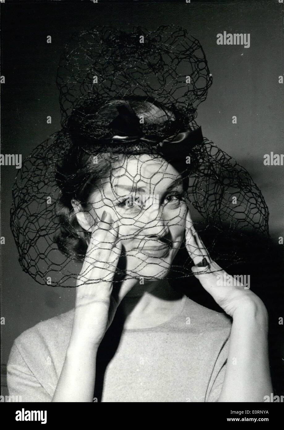 Feb. 02, 1960 - Hat Styles for Spring and Summer 1960. OPS: A very unusual hat, a straw crown with big black veil designed by Jane Blanchot and Marc Olivier. Feb. 3rd/60 Stock Photo