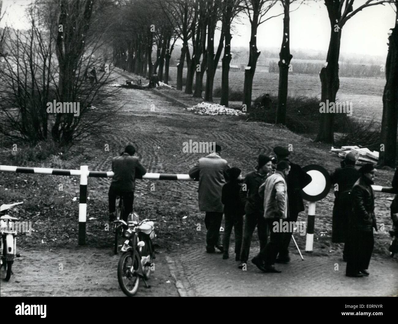 Feb. 02, 1960 - Road to East-Germany to be opened The former ''Reichs''-road No.105 between Lubeck (now West) and Seimsdorf (now East-Germany), blocked since world war 11, is to be opened again on March 1st. The ditches cut into the road b East-German police, were now filled up again. Workers of the East-German Reichsbahn had rebuilt the destroyed rals agai o the Eastern side of the border, and on Feb. 10th the former Reichs road received a new pavement. ops: a view from the Western side of the border. Stock Photo