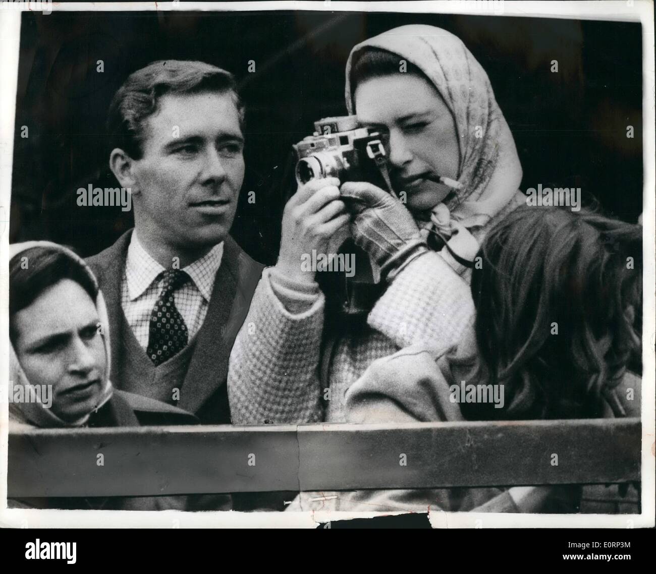 Apr. 04, 1960 - Royals Watch the Badminton Horse Trials. Photo shows Tony Armstong-Jones - the professional photographer - watches critically as his fiancee, Princess Margaret - the amateur takes a snap, at the Badminton Horse Trials yesterday. Stock Photo