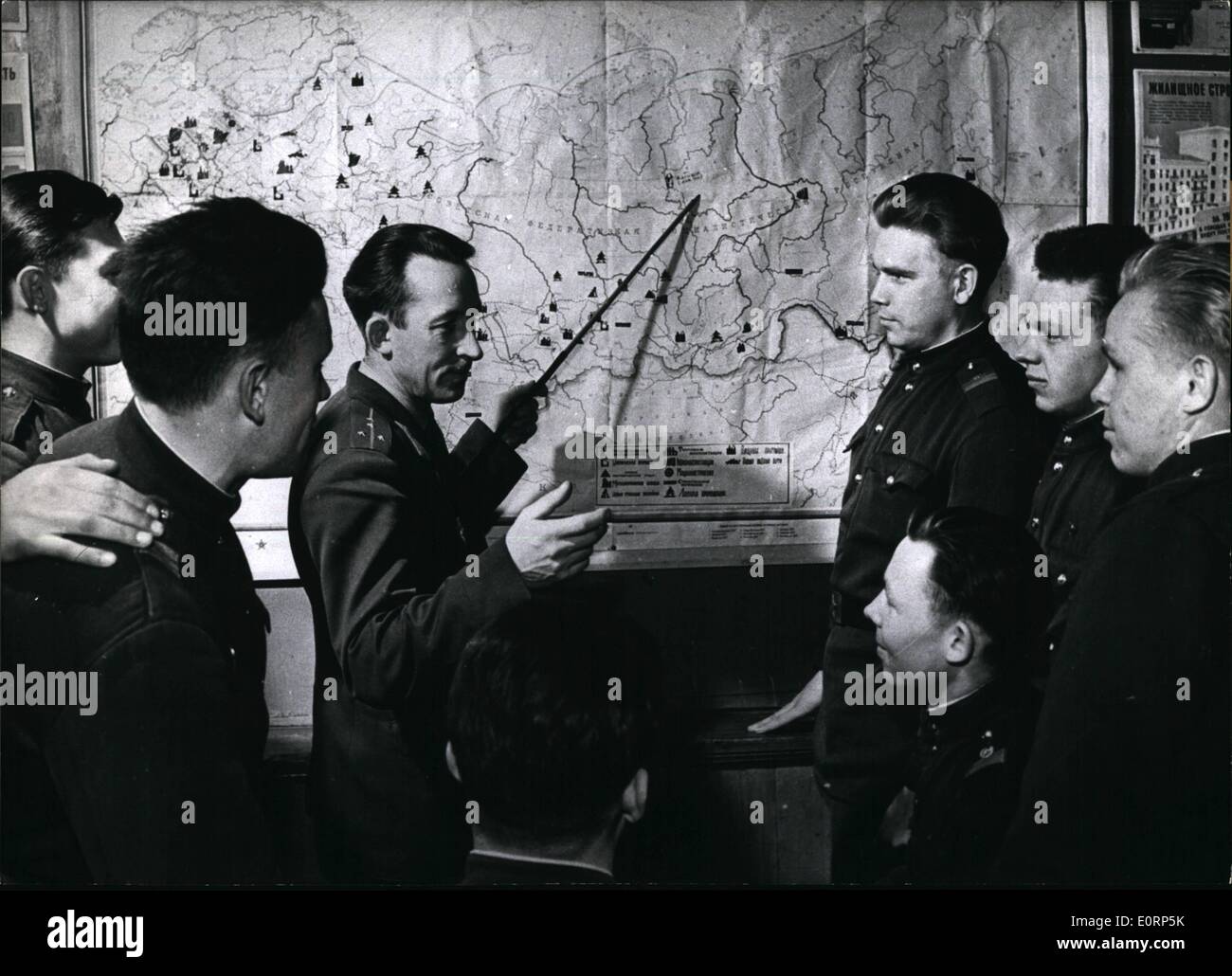 Apr. 04, 1960 - The first of 1.2 millions soldier... are being released according to Chruschtschow's plan of reducing the Soviet armed forces and using them for economical purposes. Photo Shows: Captain A. Andreen (Andreen) showing the first of the demobilized soldiers where they will probably work in future in the Soviet Union. Stock Photo