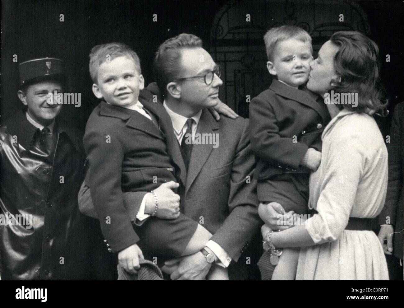 Apr. 04, 1960 - KIDNAPPED BOY FOUND OPS: FROM LEFT TO RIGHT: ROLAND PEUGEOT HOLDING IN HIS ARMS SEVEN-YEAR-OLD JEAN-PHILIPPE, THE ELDER BOY WHILE MME PEUGEOT MUGGS LITTLE ERIC. Stock Photo