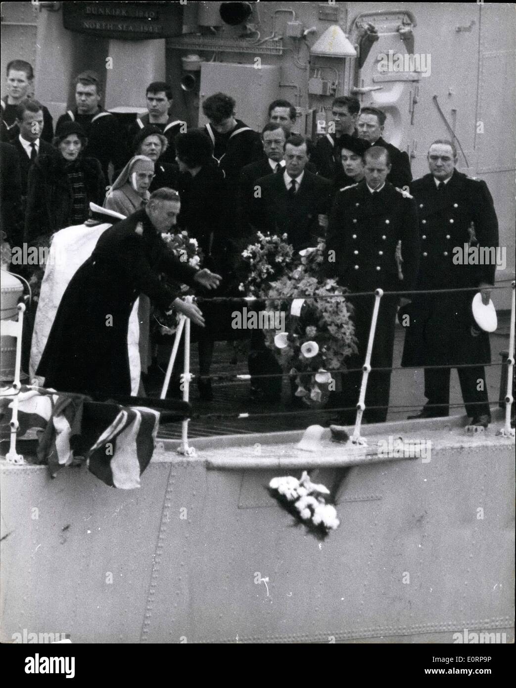 Feb. 02, 1960 - Lady Mountbatten is buried at sea as she had requested; With a simple but deeply moving ceremony, the body of Countess Mountbatten of Burma was taken out to sea aboard the frigate H.M.S. Wakeful form Portsmouth yesterday for burial, four miles of south of Nab Tower, off the Isle of Wight. Photo shows Earl Mountbatten casts his wreath into the sea after the burial service on board H.M.S. Wakeful yesterday. Also in the picture are Prince Philip, his mother Princess Andrew and the Mountbatten daughters, Lady Brabourne, and Lady Pamela Hicks. Stock Photo