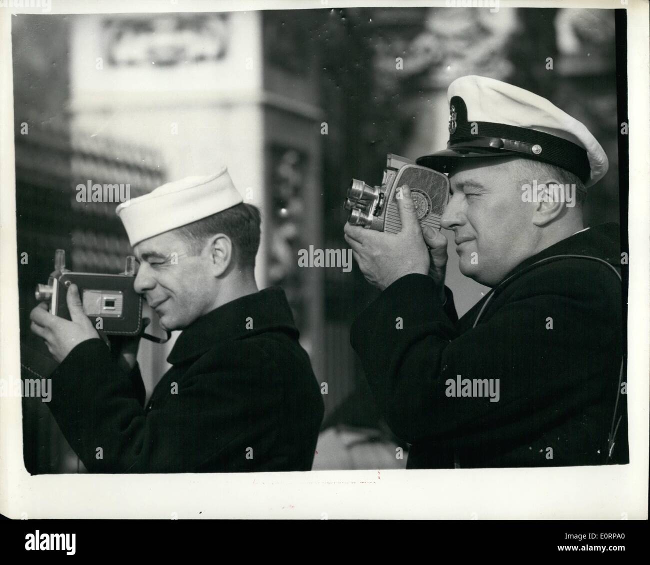 Feb. 02, 1960 - Scenes at the palace. U.S. Naval officers takes snaps. photo shows Two U.s.naval Officers from the submarine ''entemedor'' which has called in at Portland on a normal routine visits - take snap at the palace today. where the queen is awaiting the birth of here third child, They are (L to R) Petty officer it. Class, John Connolly, and Chief Petty Officer, Walter K. Moritko, both from Massachusetts. Stock Photo