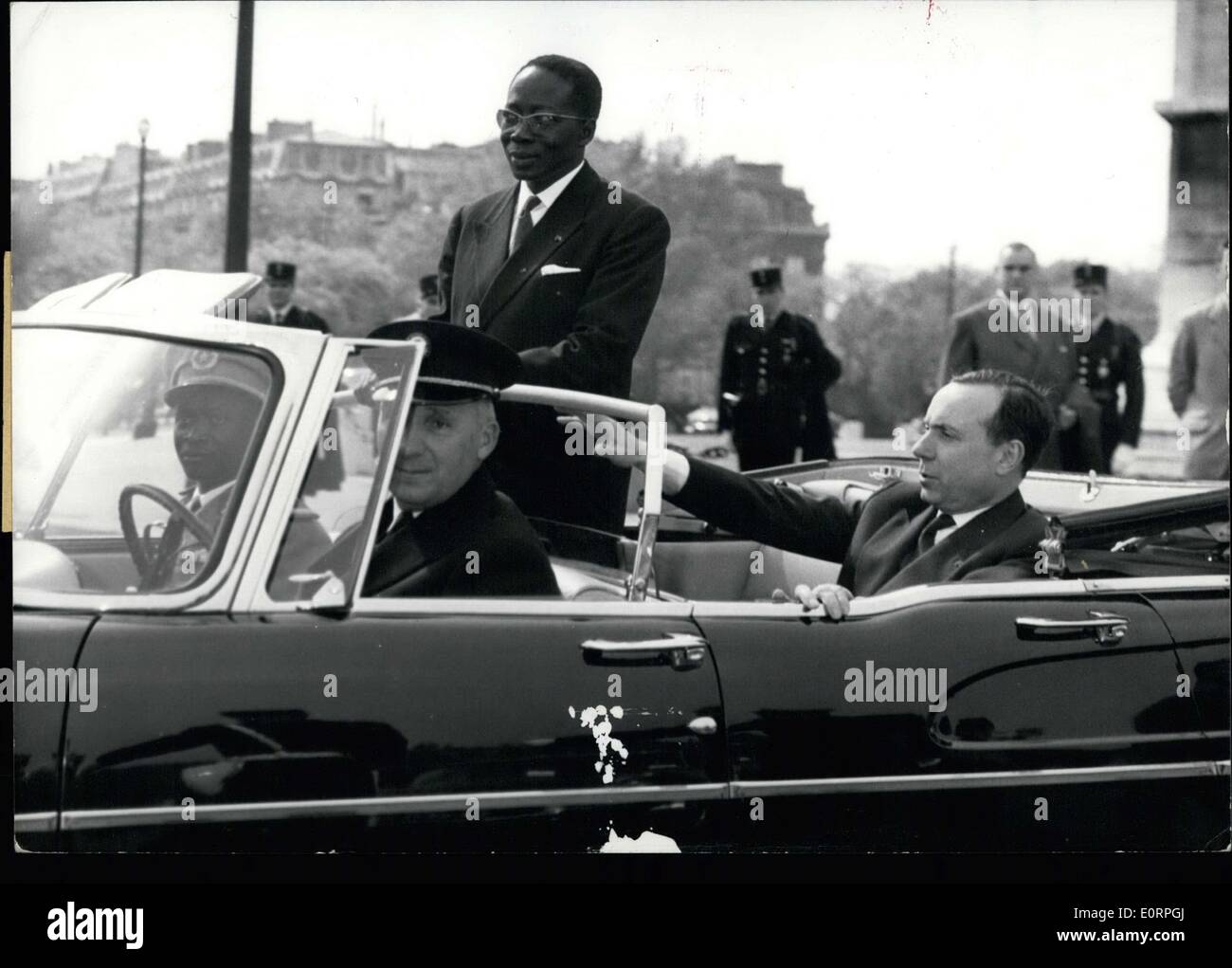 Apr. 19, 1960 - Senegal's president on state visit to Paris. Mr.Senghor, President of Senegal, standing in an open car as he left the Arc De Triomphe after laying a wreath on the tomb of the unknown soldier this afternoon. Seated next to him, Motioning to the driver is Prime Minister Michel Debre. Stock Photo