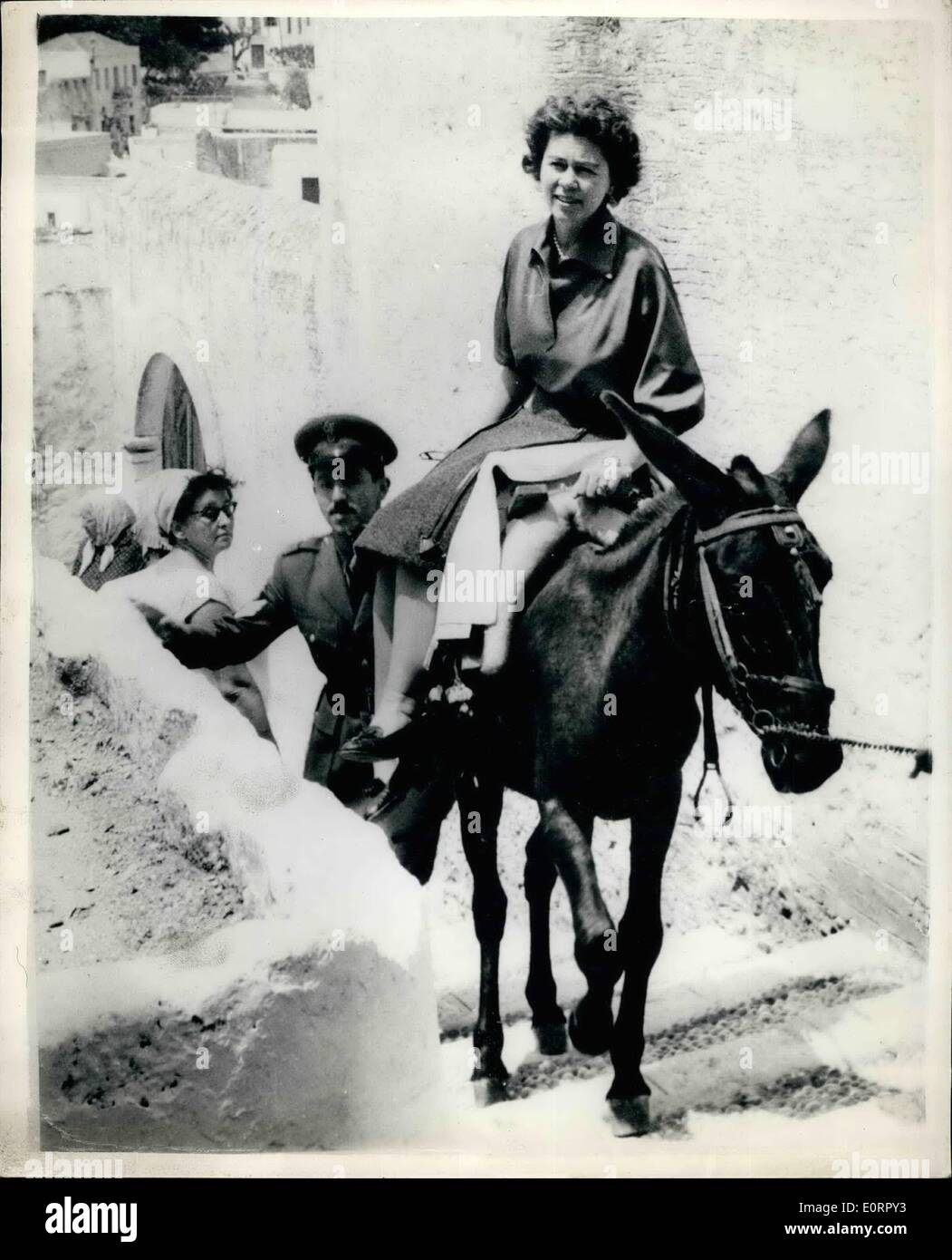 May 04, 1960 - 4.5.60 Queen Frederica of Greece takes a ride on a mule. Photo Shows: Queen Frederica of Greece takes a ride on the back of a mule when she made a tour of Rhodes Island with other members of the Royal Family. Stock Photo