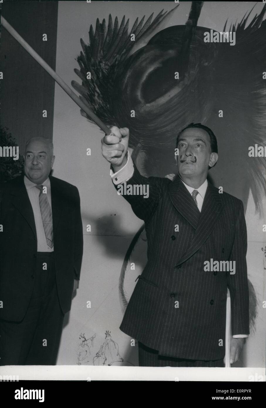 May 05, 1960 - Satan as seen by salvador Dali: Salvador Dali, The famous surrealist painter is now exhibiting 100 paintings me has just completed to illustrate Dante's ''La Divina comedia''. Photo shows Salvador Dali before one of his paintings entitled ''The satan' Stock Photo