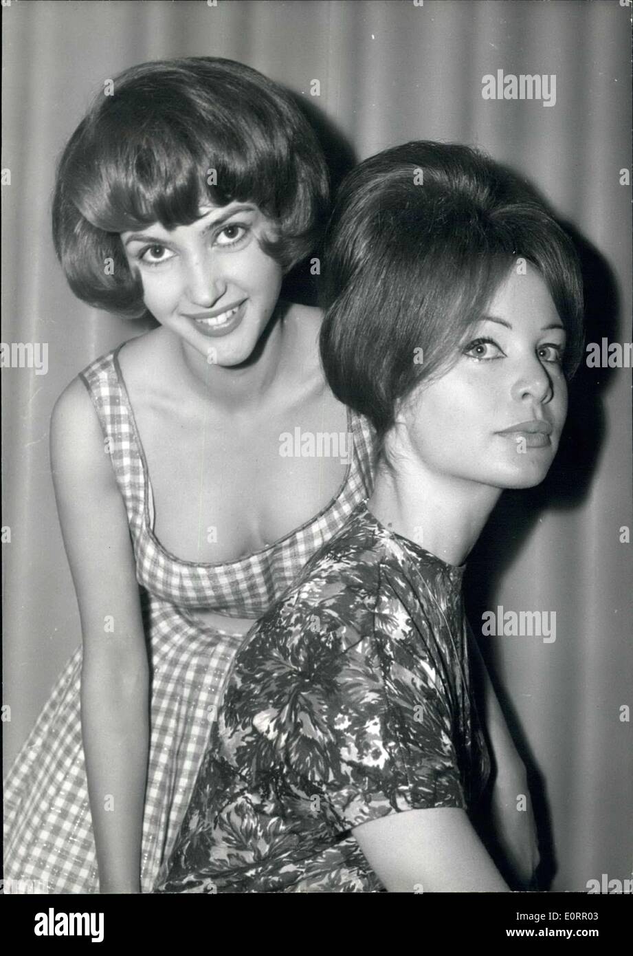 May 05, 1960 - Eighteen-year old Starlet launches new hair style.: Photo shows Claude Arnold (left), the latest discovery of the ''new wave'' who starred in the film ''Les Nymphettes''presents a new hair style specially designed for her by hairdresser Alexandre pictured nest to her is another young actress Vicky Viard. Stock Photo