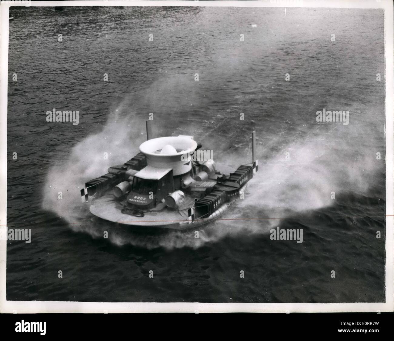 May 05, 1960 - The ''Hovercraft'' shows off its paces on the thames. Demonstration for M.P's and Commonwealth Prime Ministers: The SR-N1 Hovercraft showed off its paces this afternoon on the River Thames - in front of the Houses of Parliament - for the benefit of M.P's and Commonwealth Prime Ministers assembled there. The demonstration is hoped to 'clear the way for its eventual use for commercial and other purposes''. This is the first public showing of the craft since the Farnborough Air Show last year Stock Photo