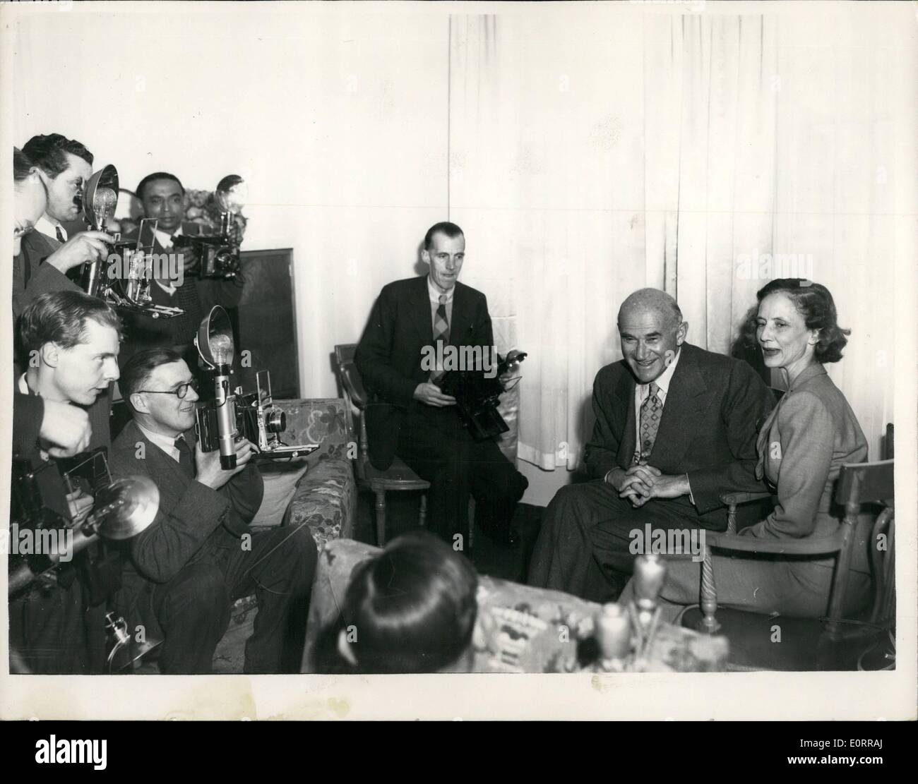 May 05, 1960 - Sam Goldwyn Holds A Press Reception... 28-4-53 He Faces The Cameras: Sam Goldwyn the American film producer who is now 70 years of age - arrived in London today and held a press reception at Claridges Hotel this afternoon. He was accompanied by his wife, Francois.. Photo shows Sam Goldwyn - for a change-faces the cameras himself -during the press conference this afternoon. Mrs Goldwyn is seen with him. Stock Photo