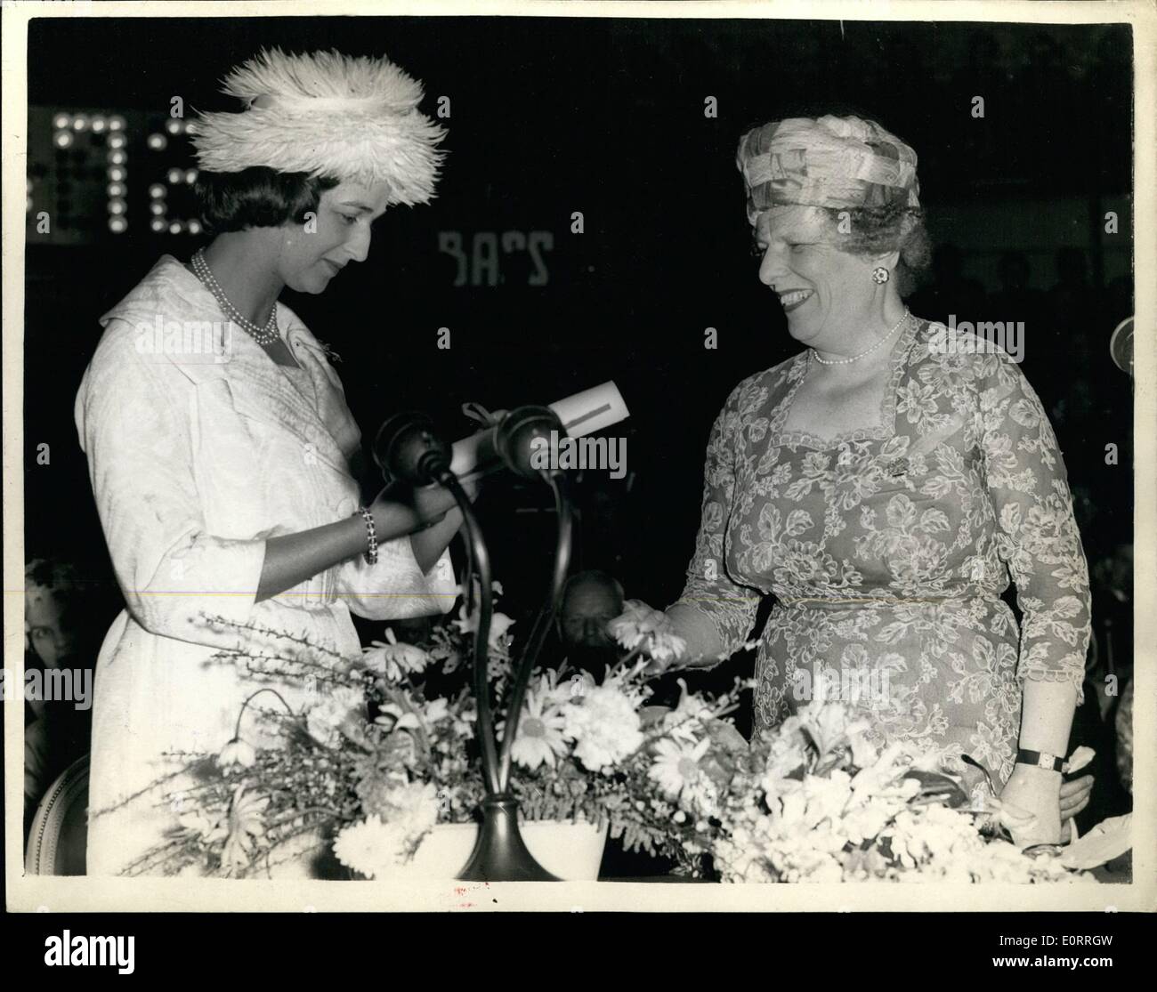 May 05, 1960 - princess Alexandra at world refugee year finale at the Albert Hall.: H.R.H. Princess Alexandra this evening attended the world refugee year finale, at the royal Albert hall, London. Photo shows Baronesselliot of Harwood, President and Chairman of the world refugee year United Kingdom Commitee, presents Princess Alexandra with a scroll containing the various sums collected - which had a grand total of ?7,736,723. Stock Photo