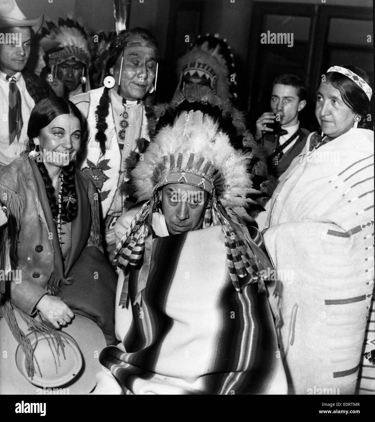 Actor Fernandel as a Native American in a film scene Stock Photo