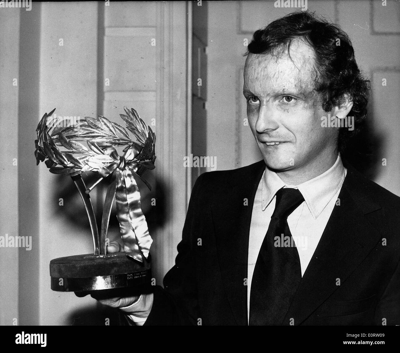racer-niki-lauda-holding-a-trophy-E0RW09.jpg