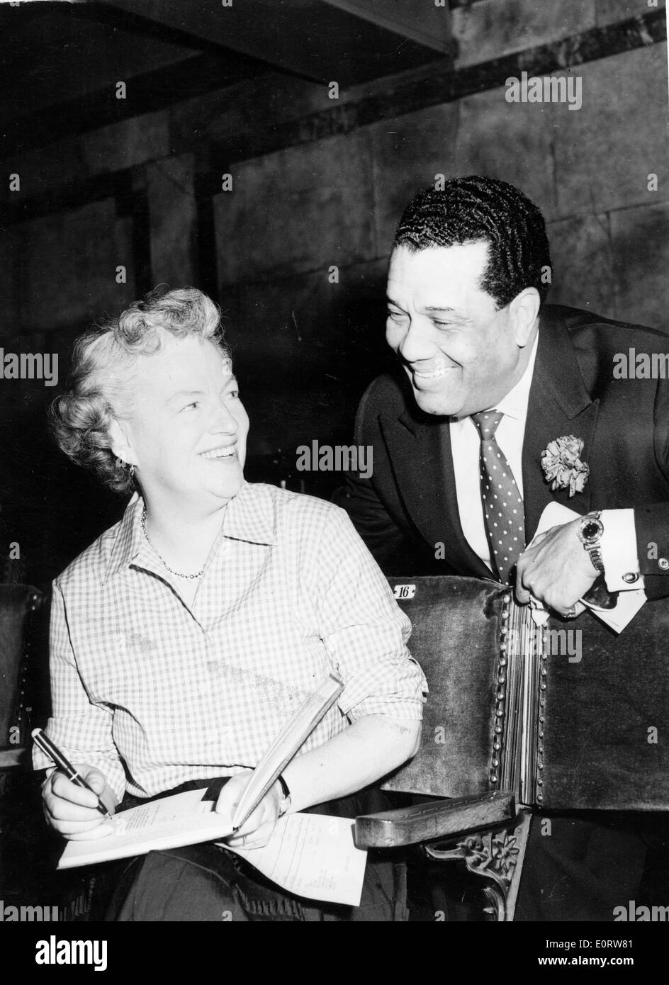 Actress Gracie Fields autographs a book Stock Photo