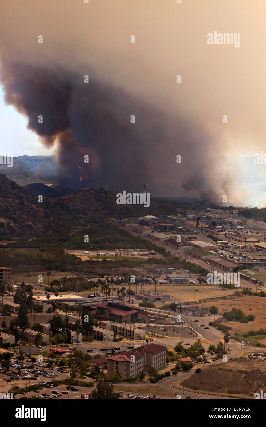 Aerial view of the Las Pulgas wildfire as it burns the foothills around the Marine Corps Air Station May 16, 2014 in Camp Pendleton, California.  Evacuations forced more than 13,000 people from their homes as the fire burned across San Diego County. Stock Photo