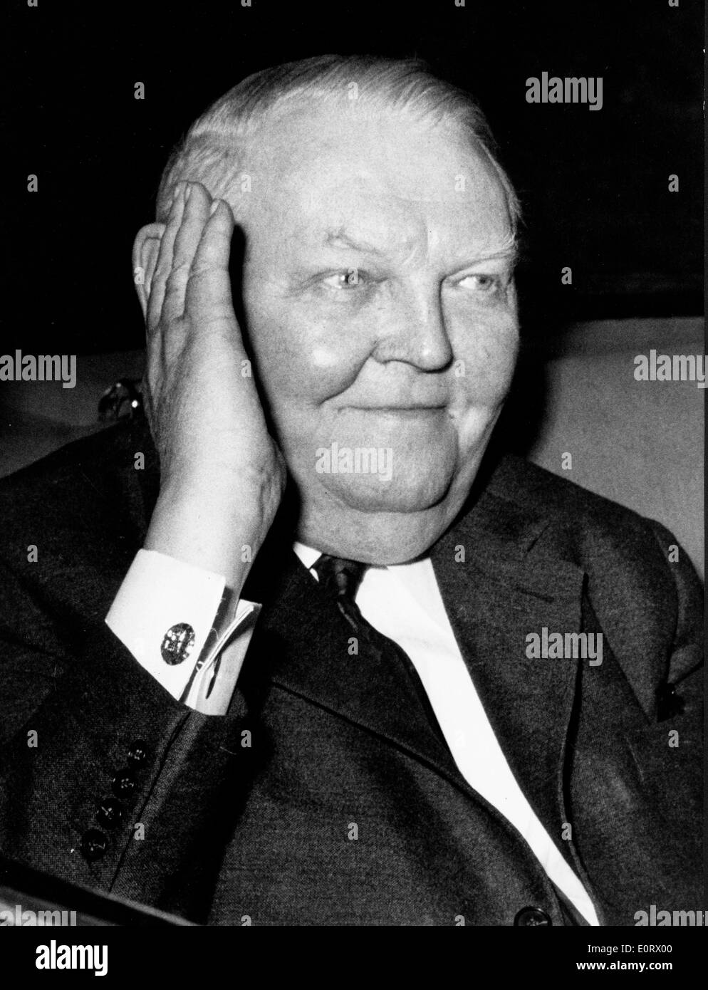 Ludwig Erhard covering part of his face Stock Photo