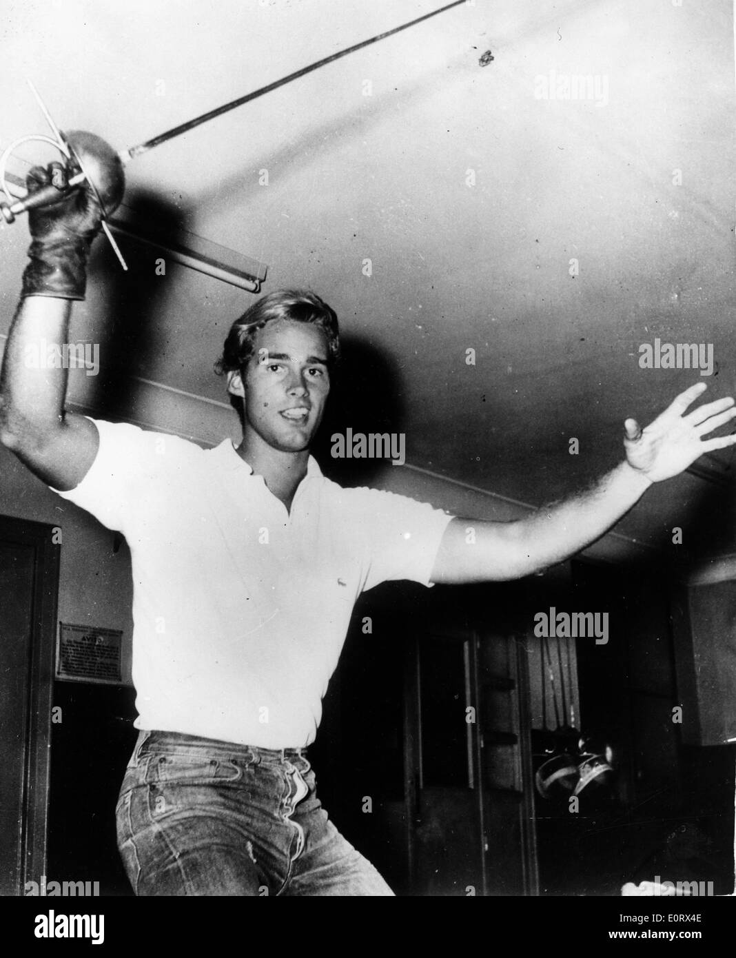 Actor Sean Flynn sword fights in film scene Stock Photo